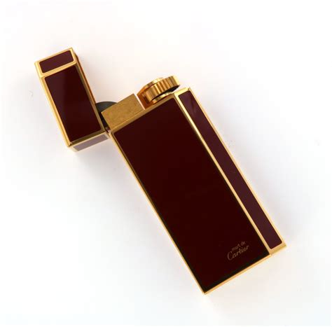 Prezzo accendini cartier oro .